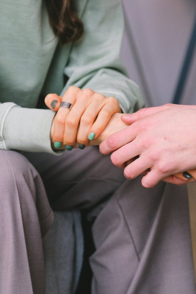 Crop psychologist supporting patient during counseling indoors